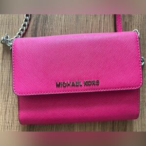 Michael Kors hot pink purse with silver chain, gently used, great condition!